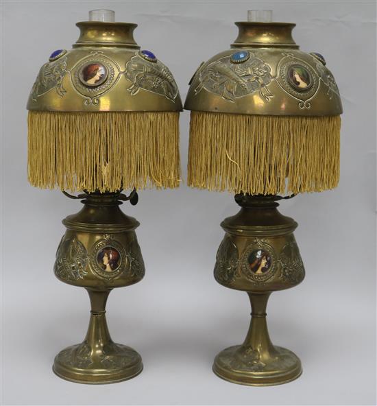A pair of French decorative oil lamps